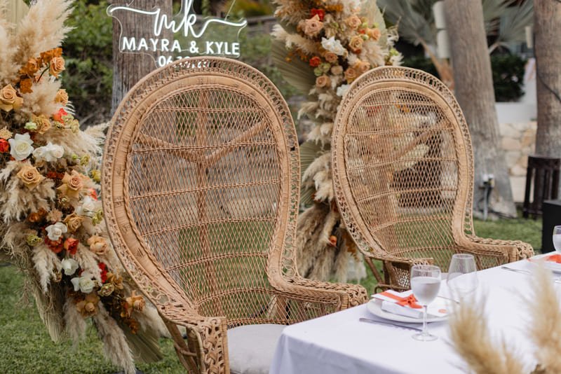 Peacock chairs Floral decor in los cabos